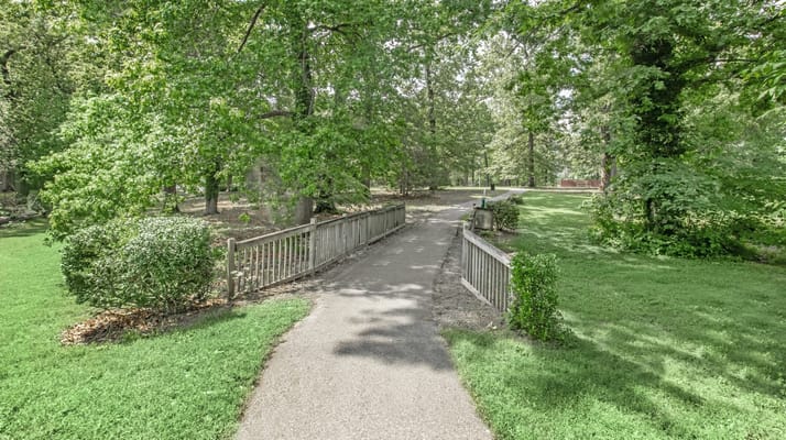Pathway in a serene outdoor space with lush greenery
