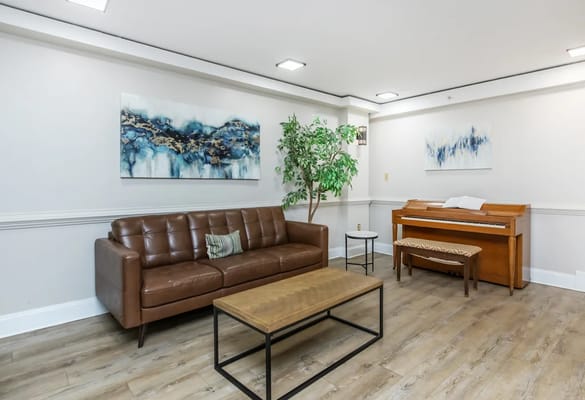 Cozy interior lounge with a sofa and piano