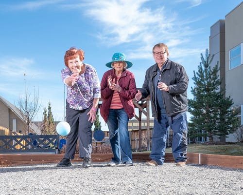 Residents enjoying an outdoor bocce ball game