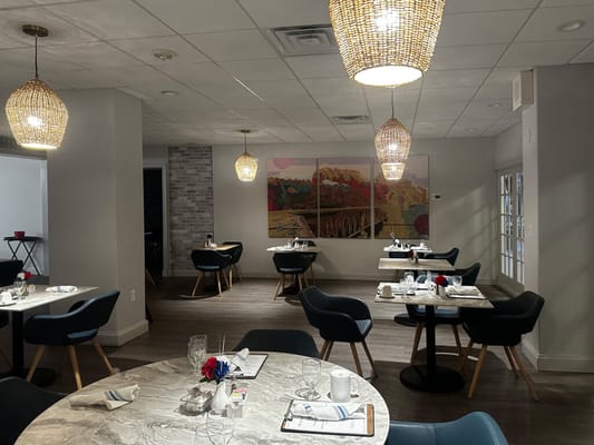 Bright dining area with modern decor and tables