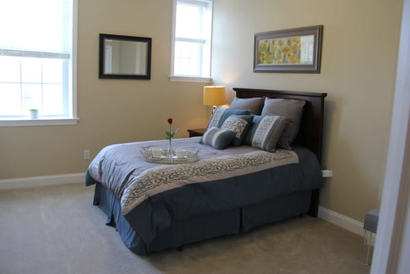 Cozy bedroom with a bed and lamp