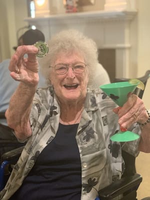 Resident enjoying a drink in a lively atmosphere
