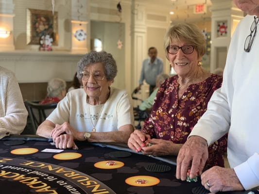 Residents participating in a game activity in a common area
