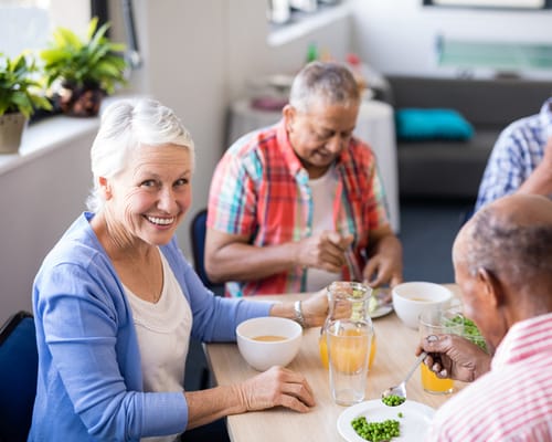 Residents enjoying a meal together in a dining area