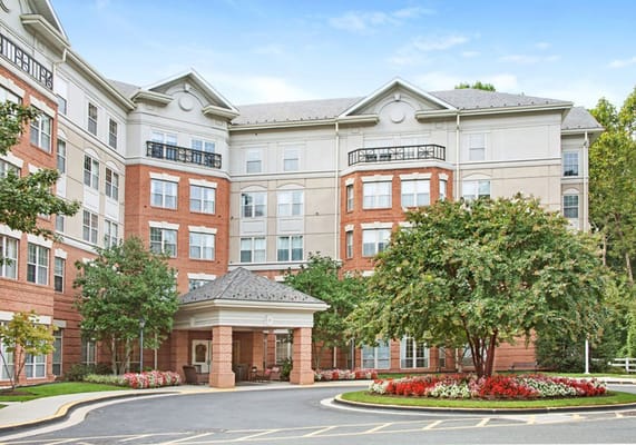 Exterior view of a senior living community with landscaping