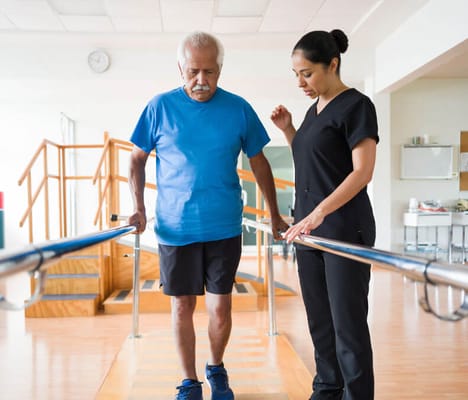 Therapist assisting a resident during rehabilitation
