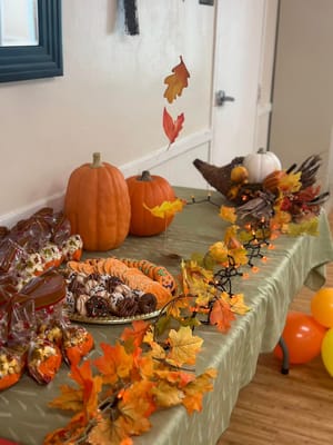 Decorative table setting for a fall celebration with treats
