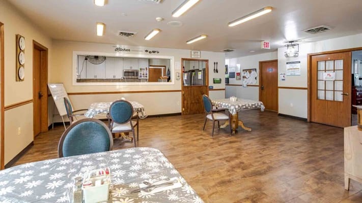 Bright dining area with tables and chairs