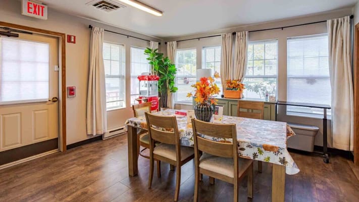 Bright and inviting dining area decorated with flowers