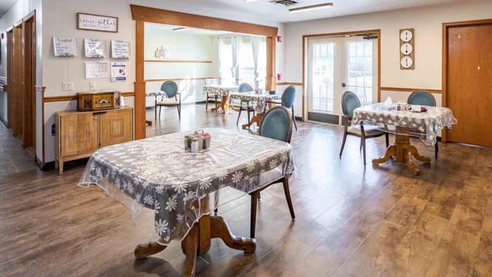 Interior view of a dining area with tables set