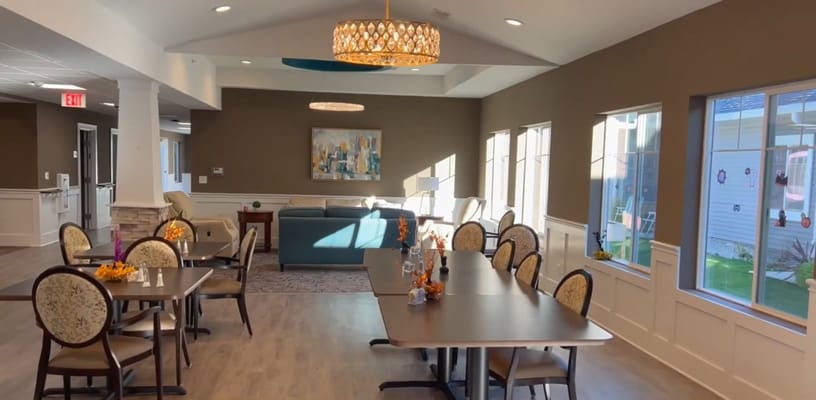 Bright common area with tables and seating