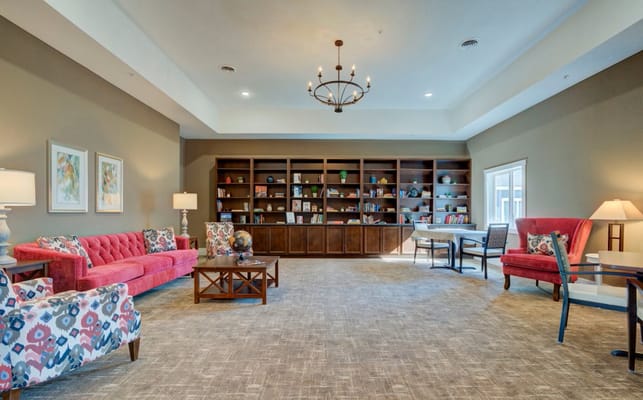 Interior common area with seating and bookshelves