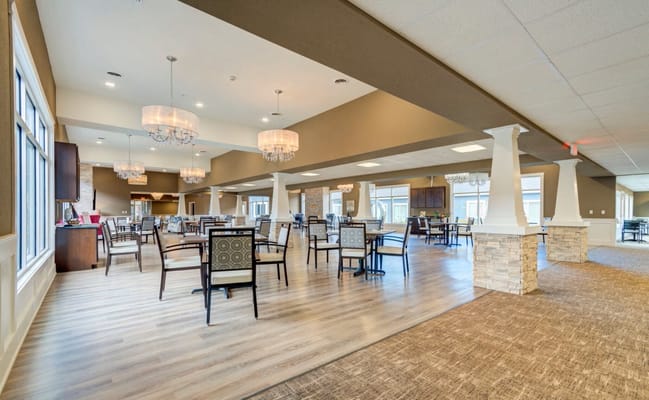 Bright dining area with tables and chairs