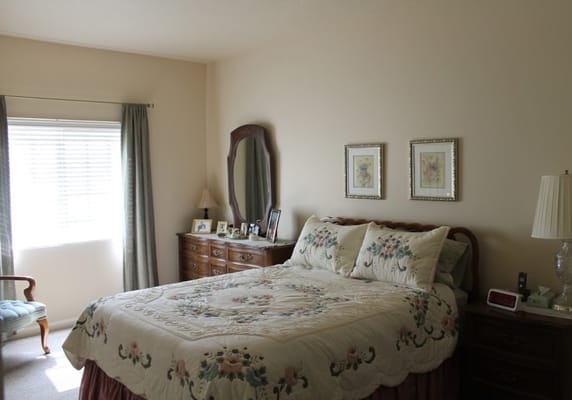 Cozy bedroom with floral bedding and natural light