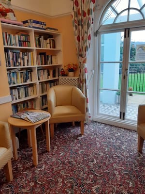 Cozy reading nook with bookshelves and outdoor view