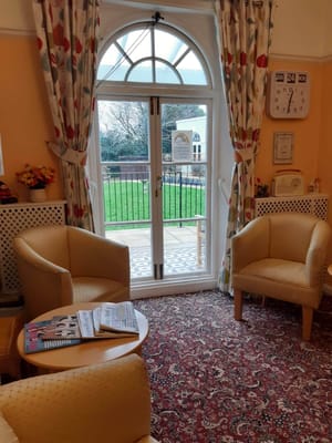 Cozy common area with chairs and a view of outdoor space
