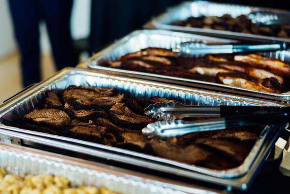 Catered meal service with various food trays