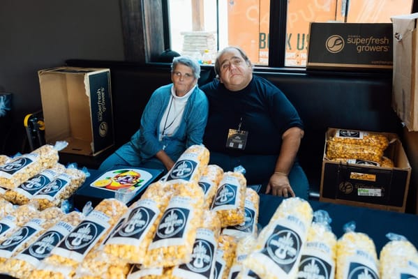 Residents enjoying popcorn at a facility event