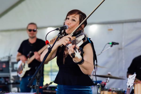 Musician performing at an outdoor event