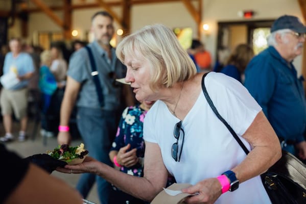 A resident enjoying food at a community event