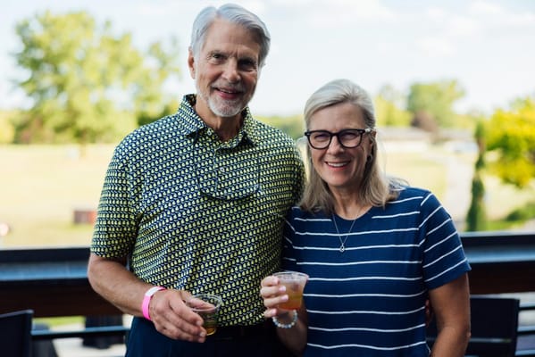 Couple enjoying drinks on a patio