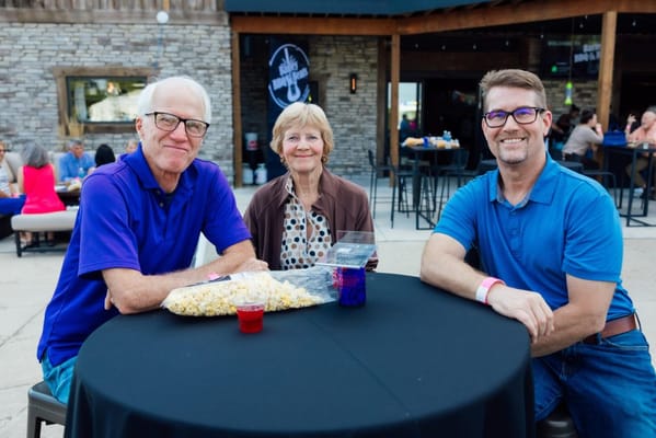 Three residents enjoying a social outdoor gathering