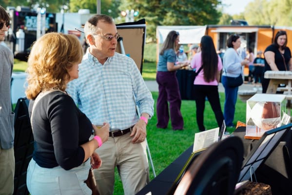 Residents interacting at an outdoor community event