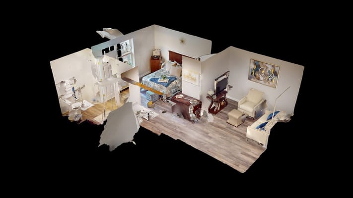 3D view of an interior room featuring a bed, seating area, and decor.