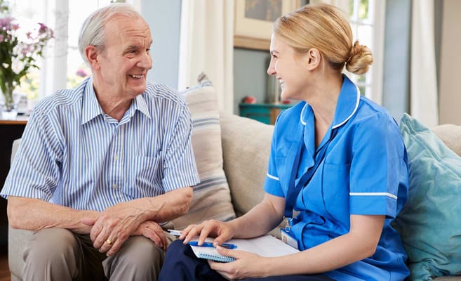 Caregiver interacting with a resident in a cozy setting