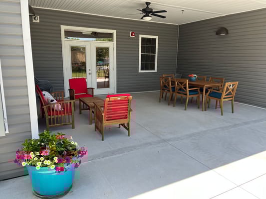 Outdoor seating area with tables and chairs