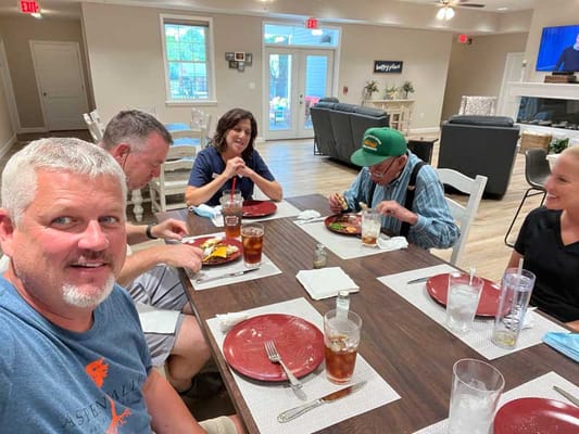 Residents enjoying a meal in the dining room