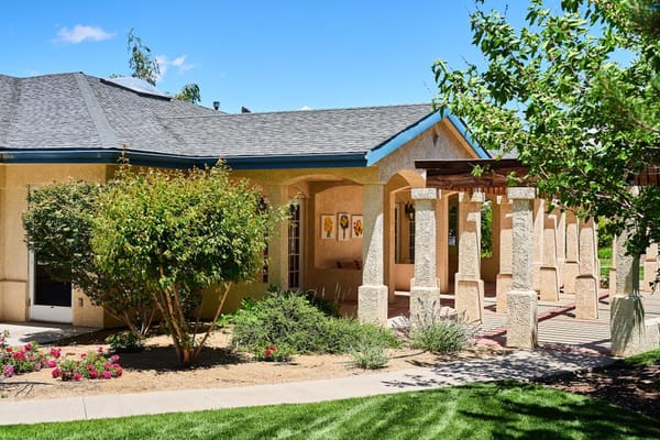 Exterior view of the facility surrounded by greenery