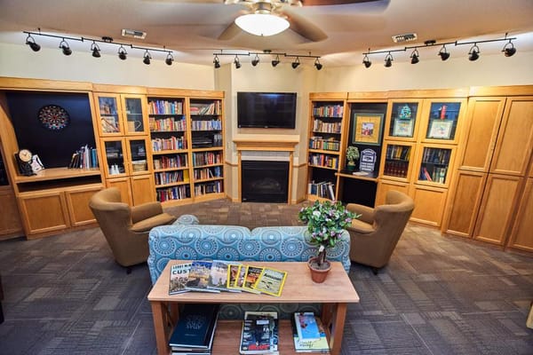 Common area with bookshelves and seating