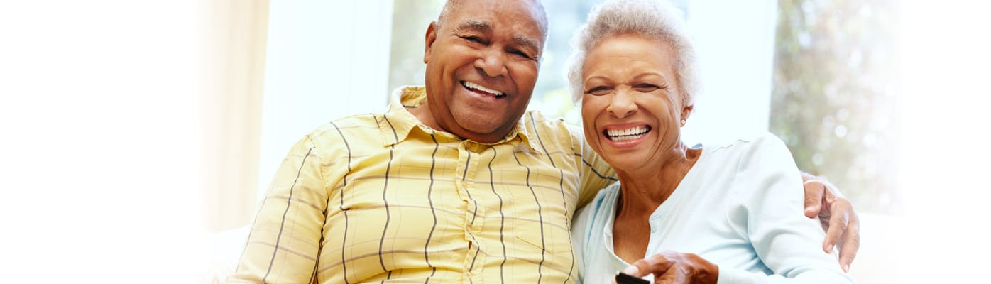 Two smiling residents enjoying time together indoors