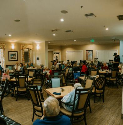 Residents enjoying a meal in the dining room