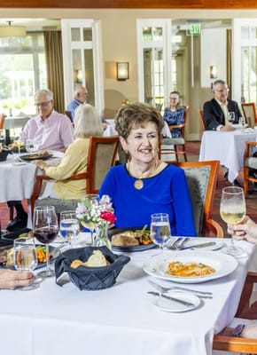 Residents dining in a bright dining room