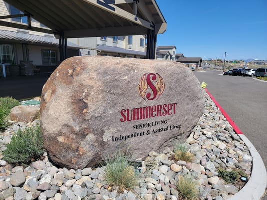 Signage at Summerset Senior Living on a large rock