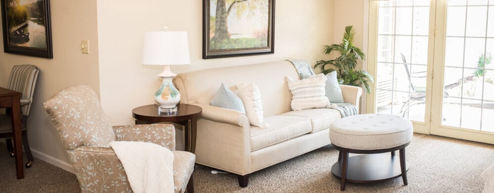 Cozy common area with a sofa and natural light