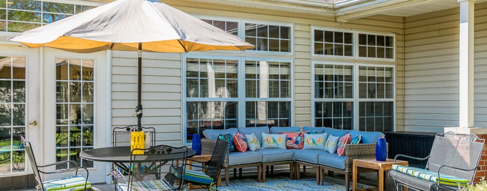 Patio area with seating and an umbrella
