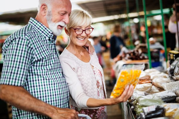 Two seniors enjoying their time at a market