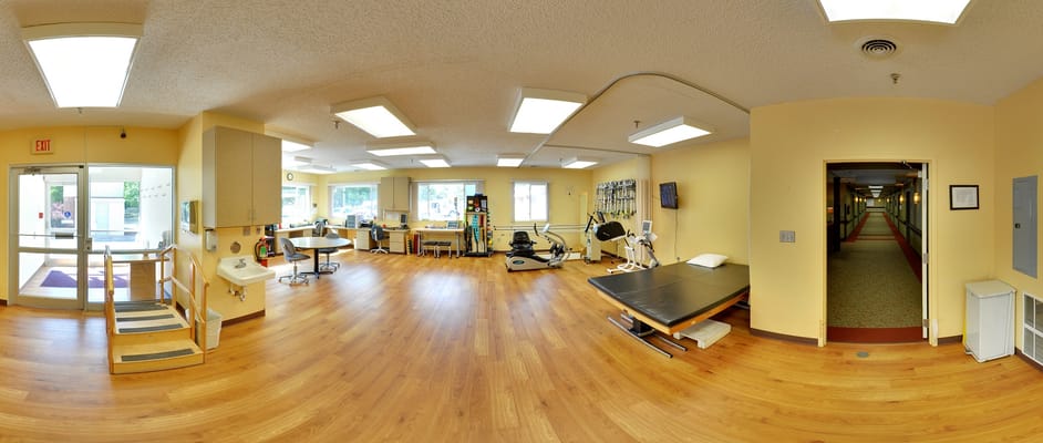 Activity room with therapy equipment and sunlight
