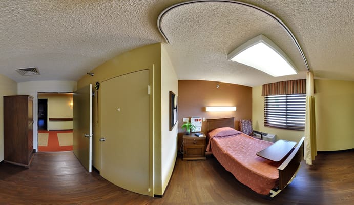 Private resident room with a bed and furnishings