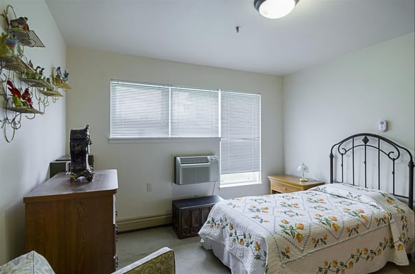 Cozy private room with bed and dresser