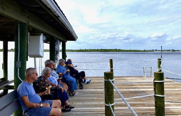 Residents enjoying a peaceful view by the water