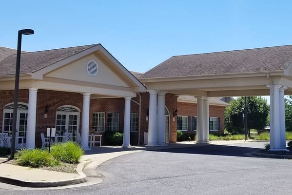 Exterior view of Meadow Park Rehabilitation & Healthcare Center with a canopy entrance