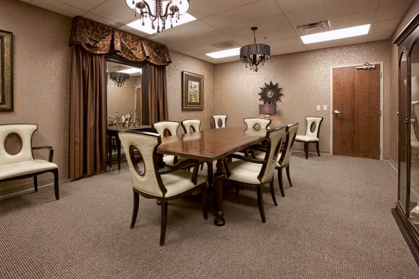 Elegant dining area with a large table and decorative chairs