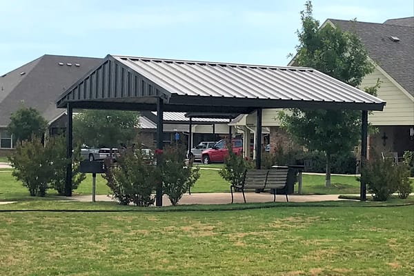 Outdoor pavilion with seating and landscaping