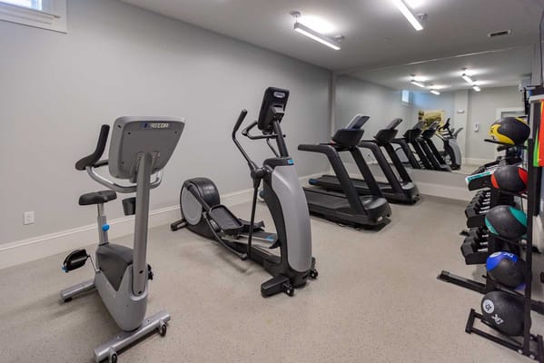 Gym area with exercise equipment at Adams House
