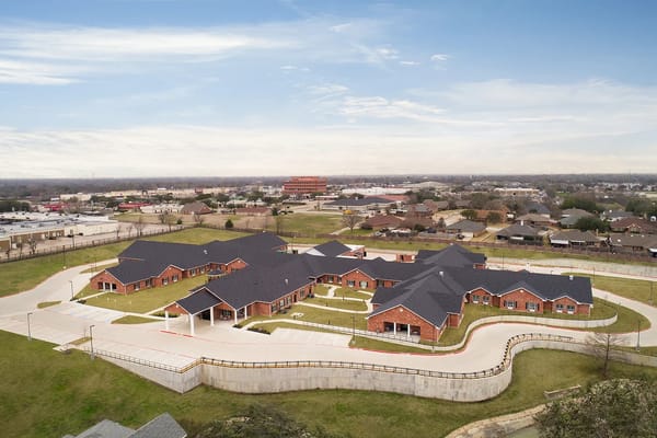 Aerial view of Advanced Health and Rehabilitation Center surrounded by green space.
