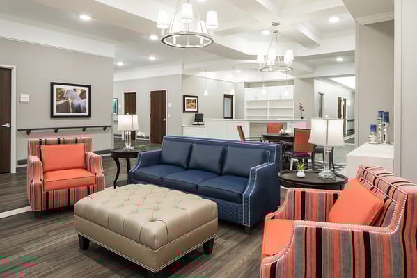 Modern living room with colorful furniture and lighting